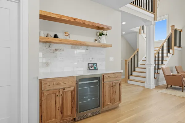a view of kitchen with kitchen island dining table and stainless steel appliances
