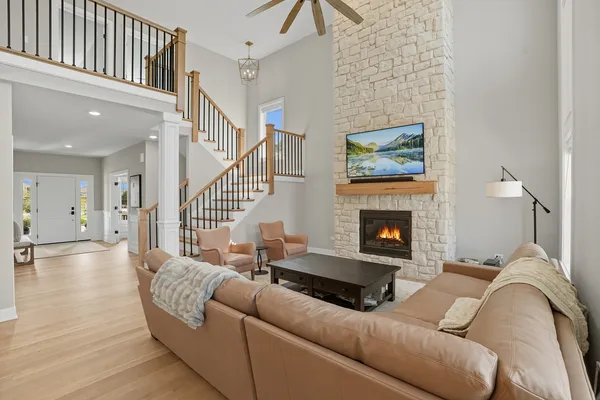 a living room with furniture and a fireplace