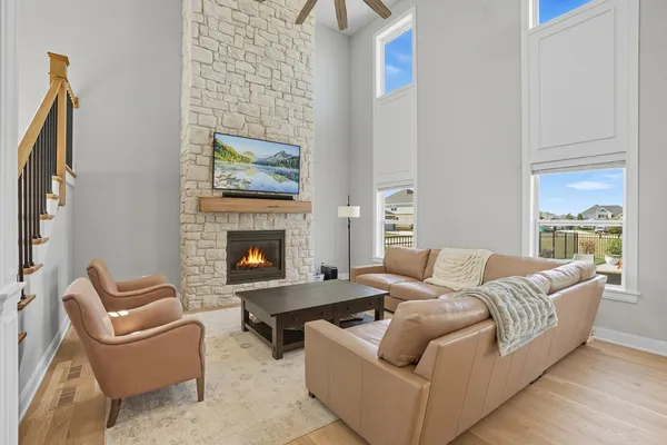 a living room with furniture kitchen view and a dining table