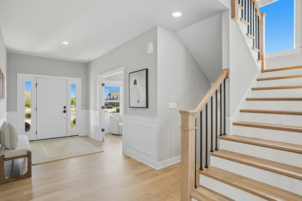 a view of an entryway with furniture and front door