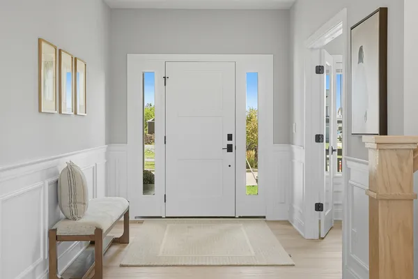 a spacious bedroom with a bed and a large window