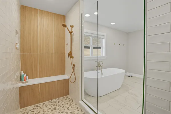 a bathroom with a double vanity sink a mirror and shower