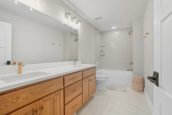 a bed room with a bed and a chandelier