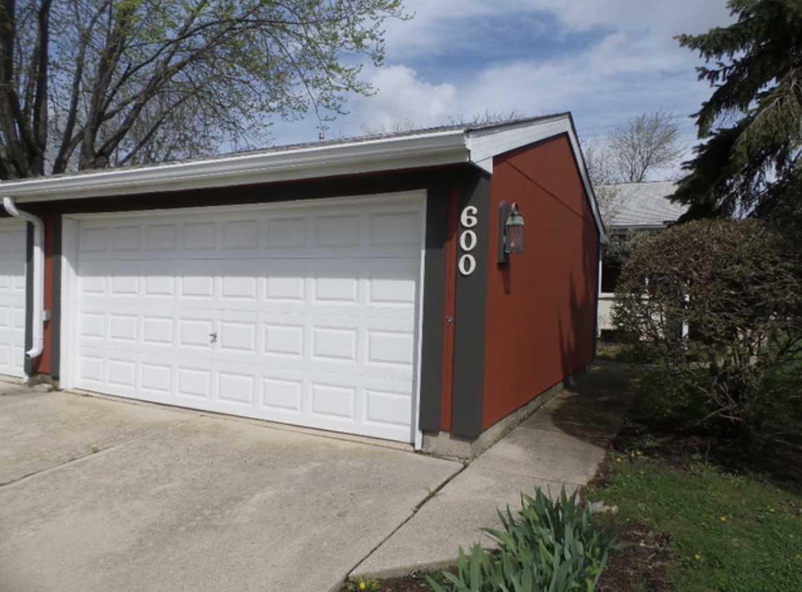 600 Pontiac Lane Bolingbrook, IL 60440 - Photo 1 of 2 a side view of a house with a yard and garage