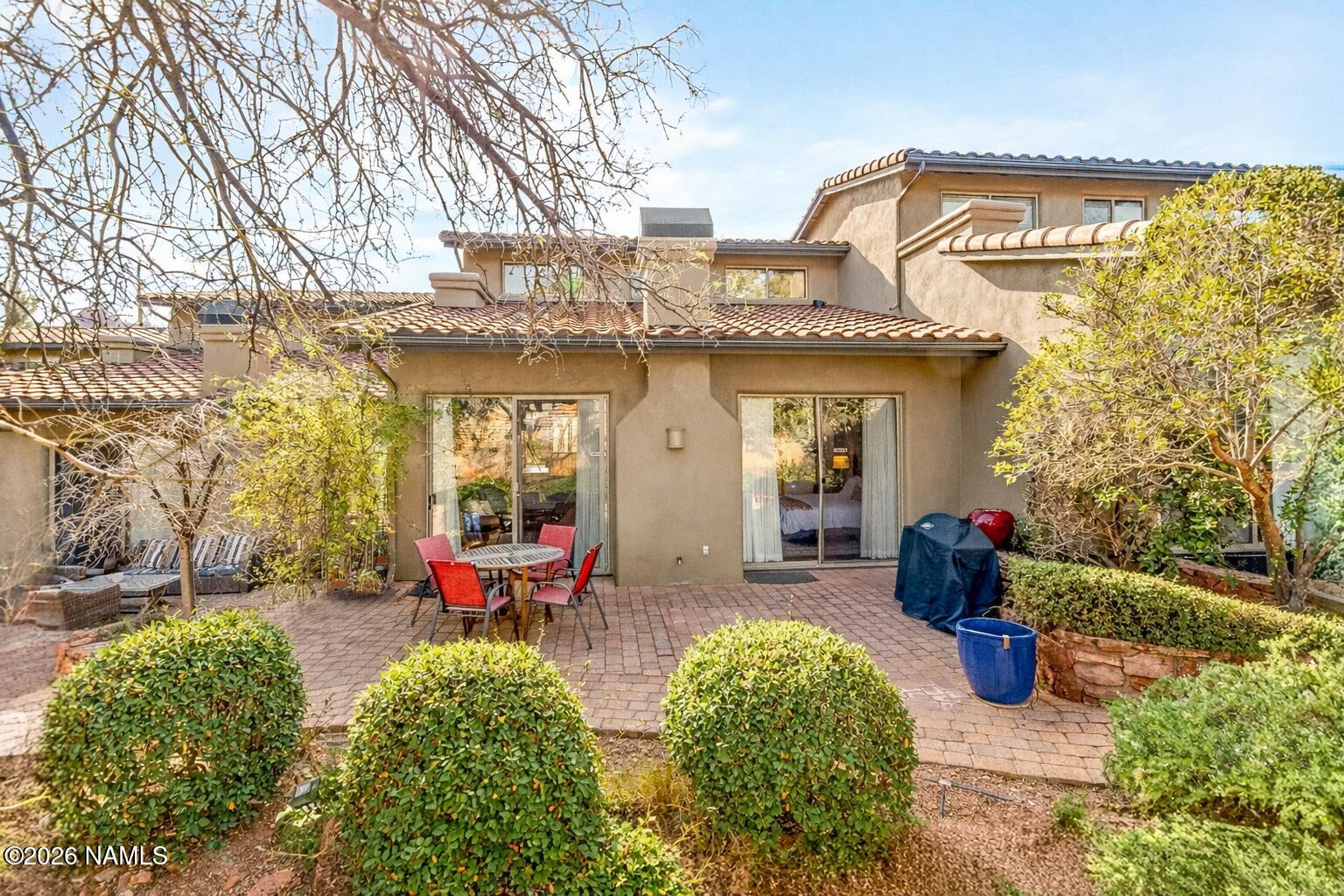 318 Capital Butte Road, Unit 2 Sedona, AZ 86336 - Photo 16 of 30 a view of a chairs and table in the patio