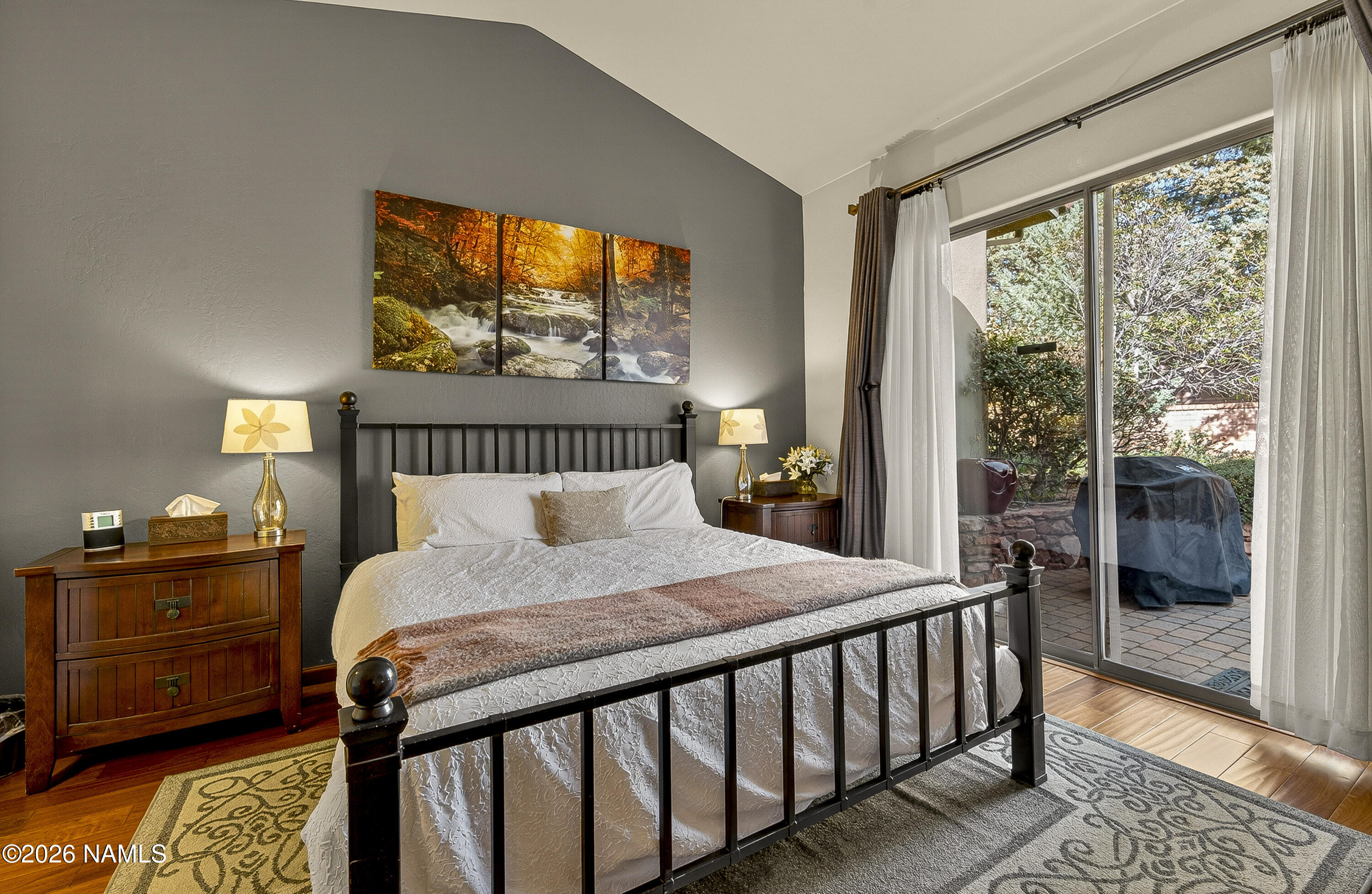 318 Capital Butte Road, Unit 2 Sedona, AZ 86336 - Photo 17 of 30 a bedroom with a bed and a window