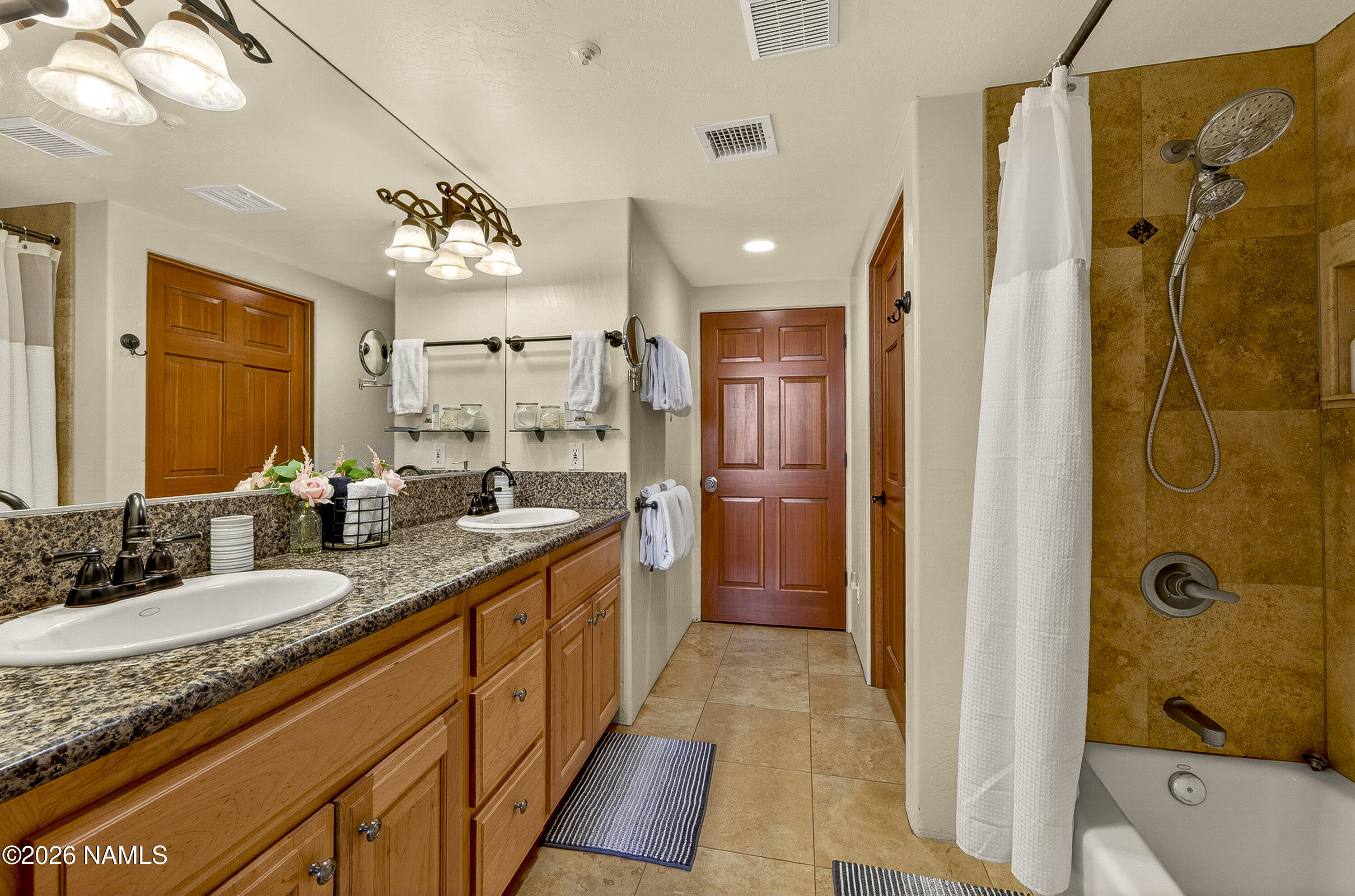 318 Capital Butte Road, Unit 2 Sedona, AZ 86336 - Photo 19 of 30 a spacious bathroom with a granite countertop sink mirror and shower