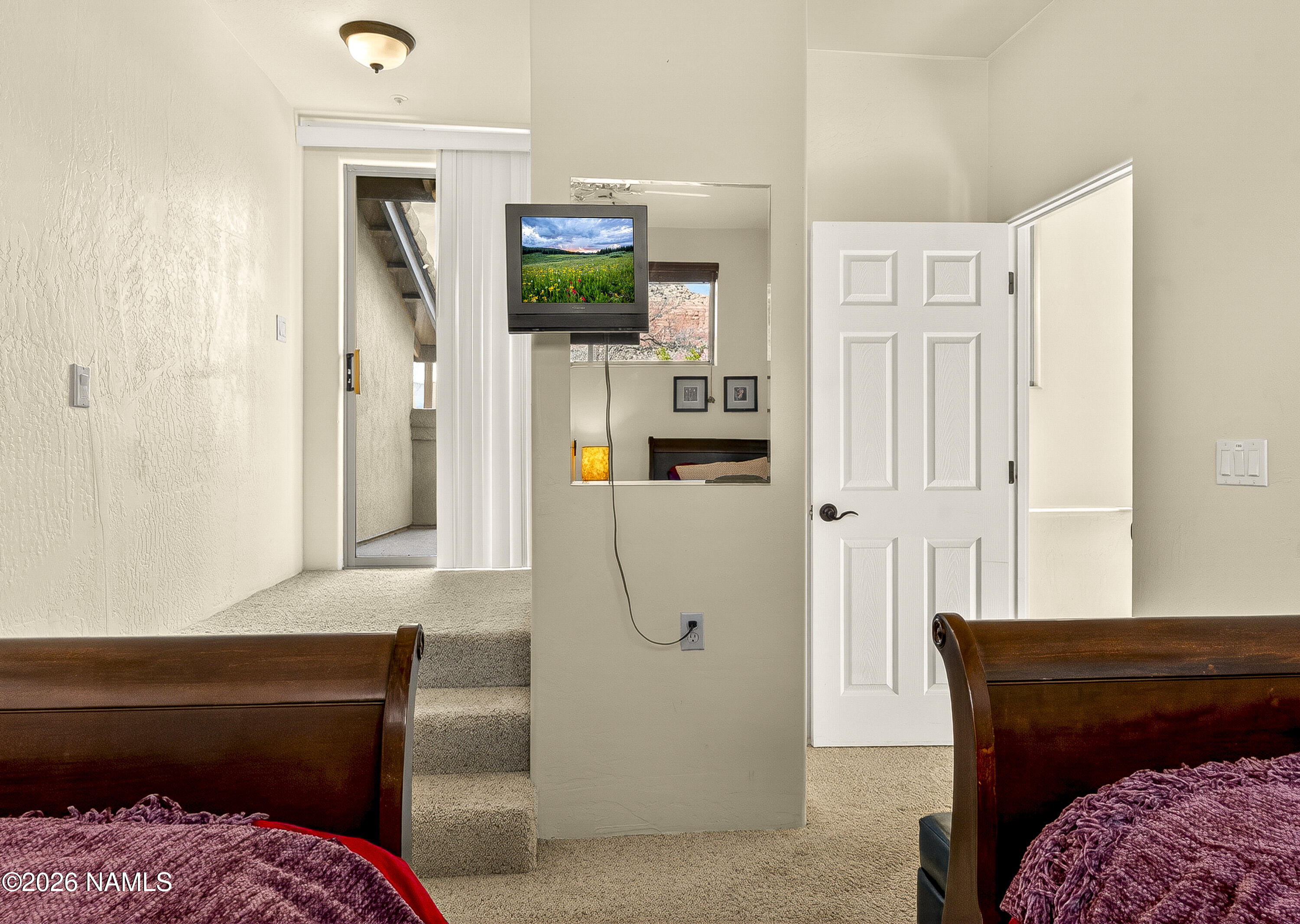 318 Capital Butte Road, Unit 2 Sedona, AZ 86336 - Photo 23 of 30 a living room with furniture and a flat screen tv