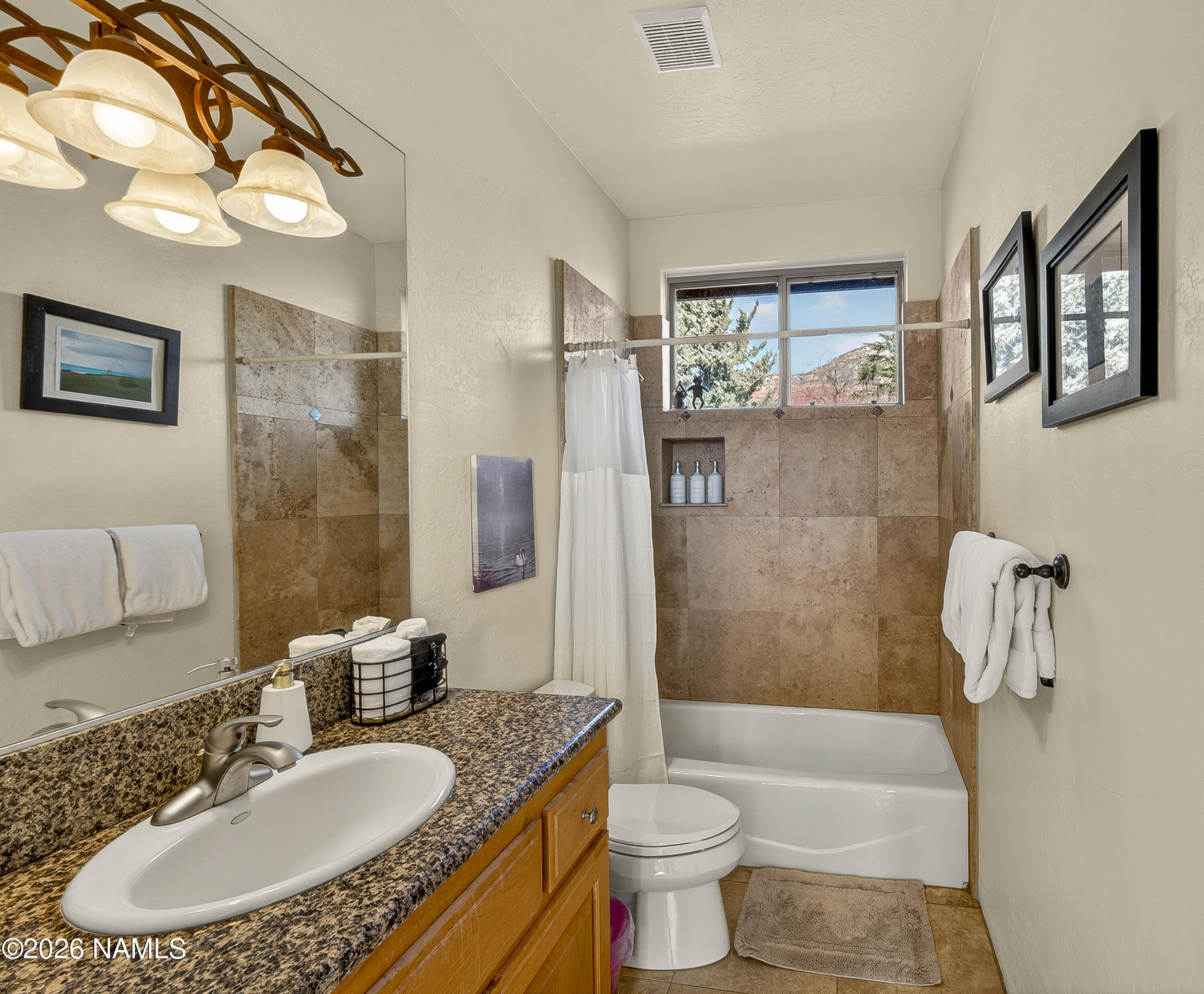 318 Capital Butte Road, Unit 2 Sedona, AZ 86336 - Photo 25 of 30 a bathroom with a granite countertop sink and a mirror