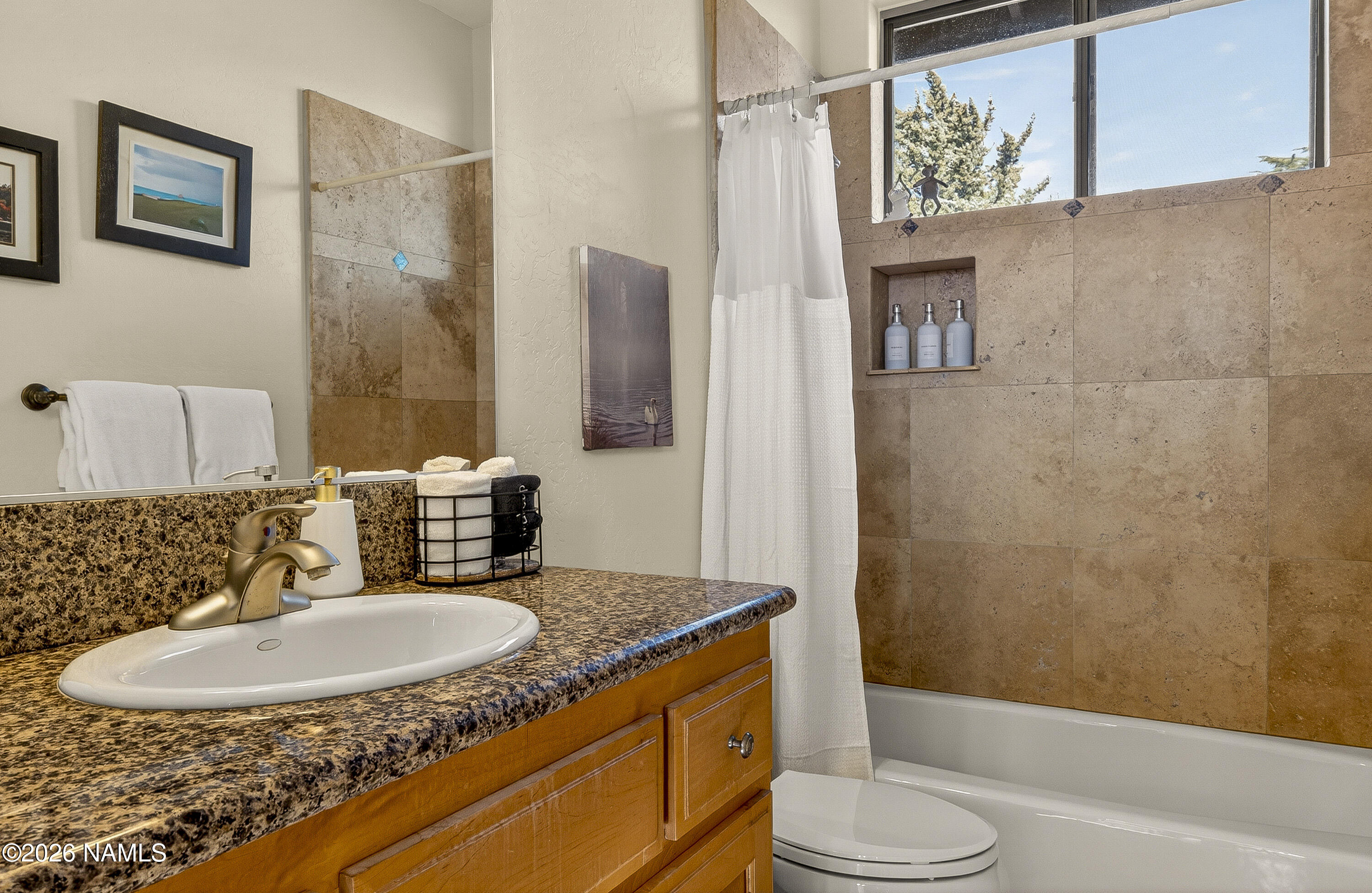 318 Capital Butte Road, Unit 2 Sedona, AZ 86336 - Photo 26 of 30 a bathroom with a granite countertop sink toilet and shower