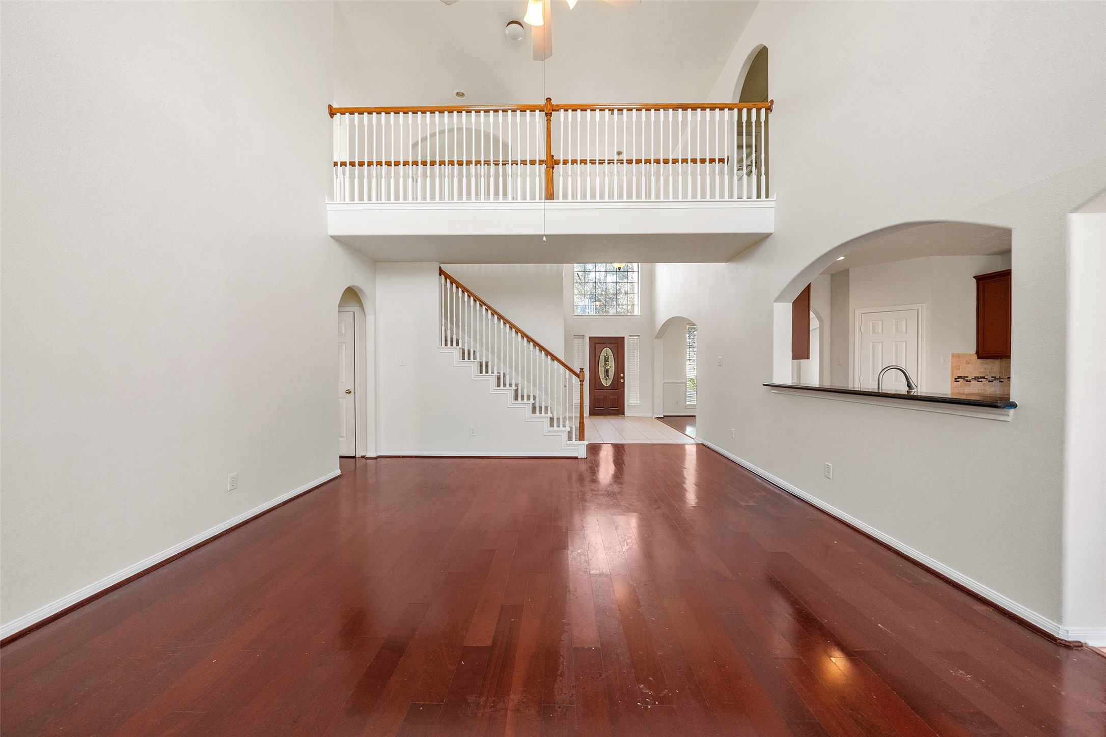 14213 Stone Bluff Lane Rosharon, TX 77583 - Photo 11 of 44 a view of staircase and kitchen with sink