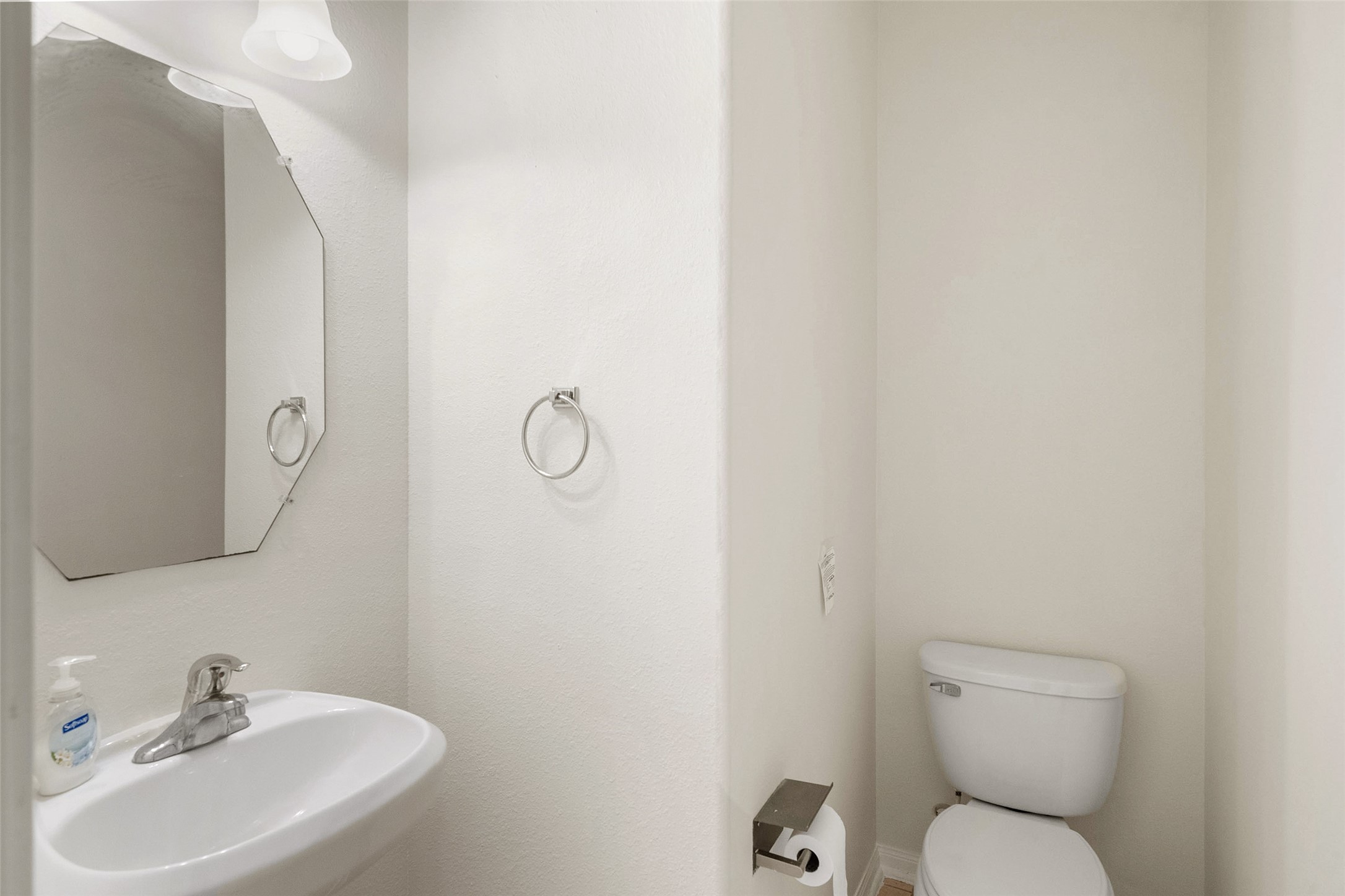 14213 Stone Bluff Lane Rosharon, TX 77583 - Photo 30 of 44 a bathroom with a toilet sink and mirror