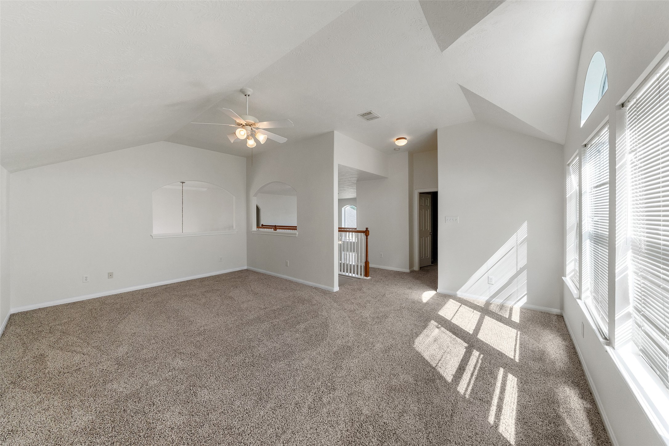 14213 Stone Bluff Lane Rosharon, TX 77583 - Photo 32 of 44 an empty room with windows and ceiling fan