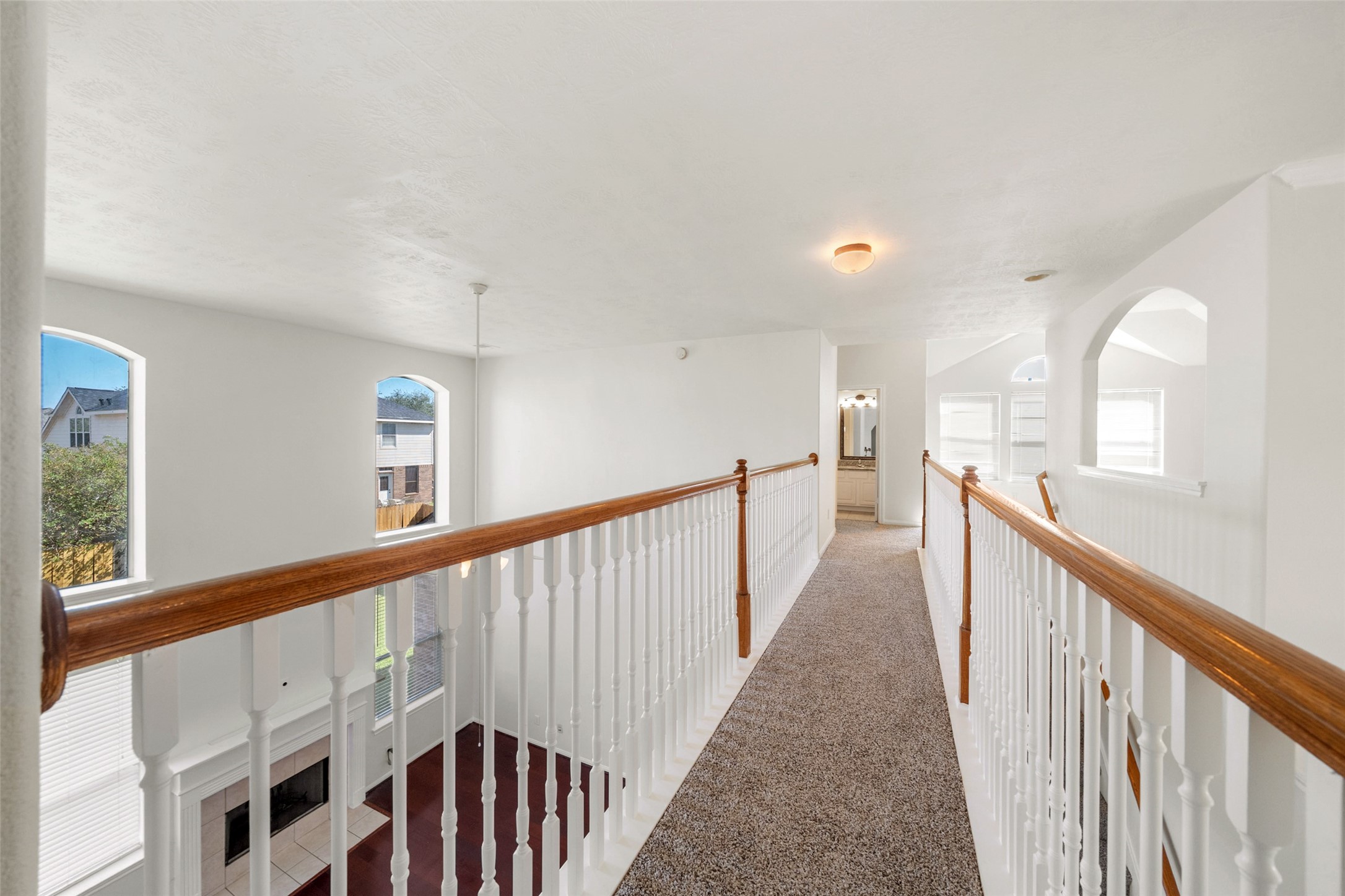 14213 Stone Bluff Lane Rosharon, TX 77583 - Photo 33 of 44 a view of a hallway with wooden floor and windows
