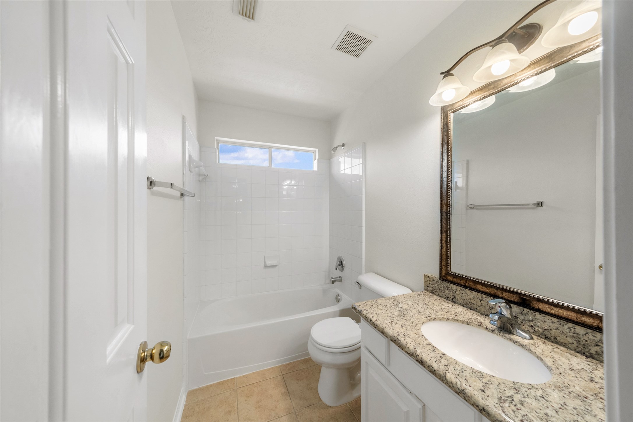 14213 Stone Bluff Lane Rosharon, TX 77583 - Photo 39 of 44 a bathroom with a granite countertop sink a toilet a mirror and shower
