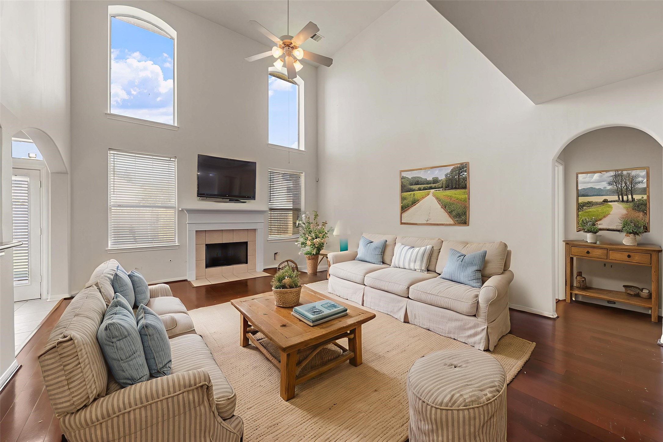 14213 Stone Bluff Lane Rosharon, TX 77583 - Photo 6 of 44 a living room with furniture a fireplace and a flat screen tv
