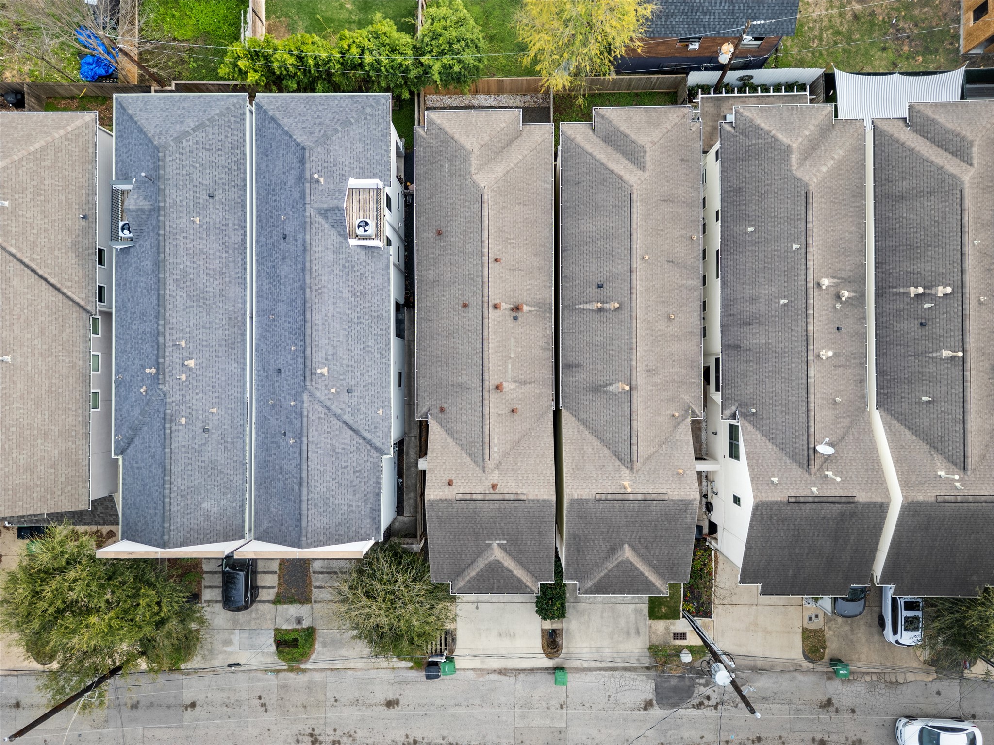 4409 Schuler Street, Unit A Houston, TX 77007 - Photo 31 of 33 Aerial view displaying the property's shingle roof structure and its position among the adjoining units.