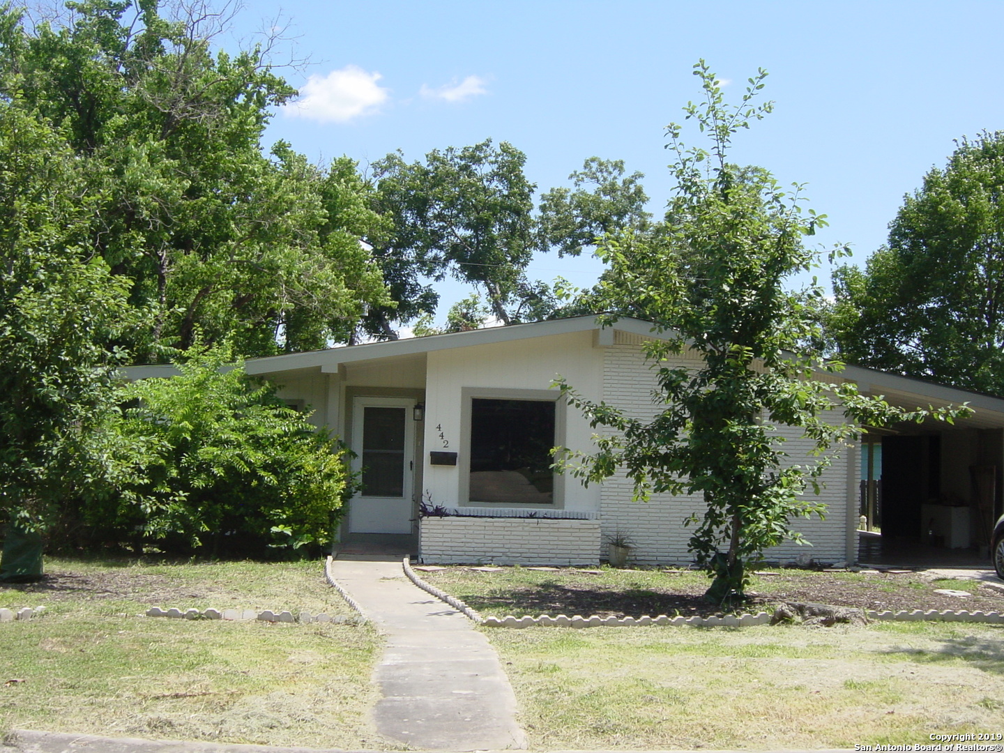 442 Sharon Drive San Antonio, TX 78216 - Photo 1 of 15 a house with trees in front of it