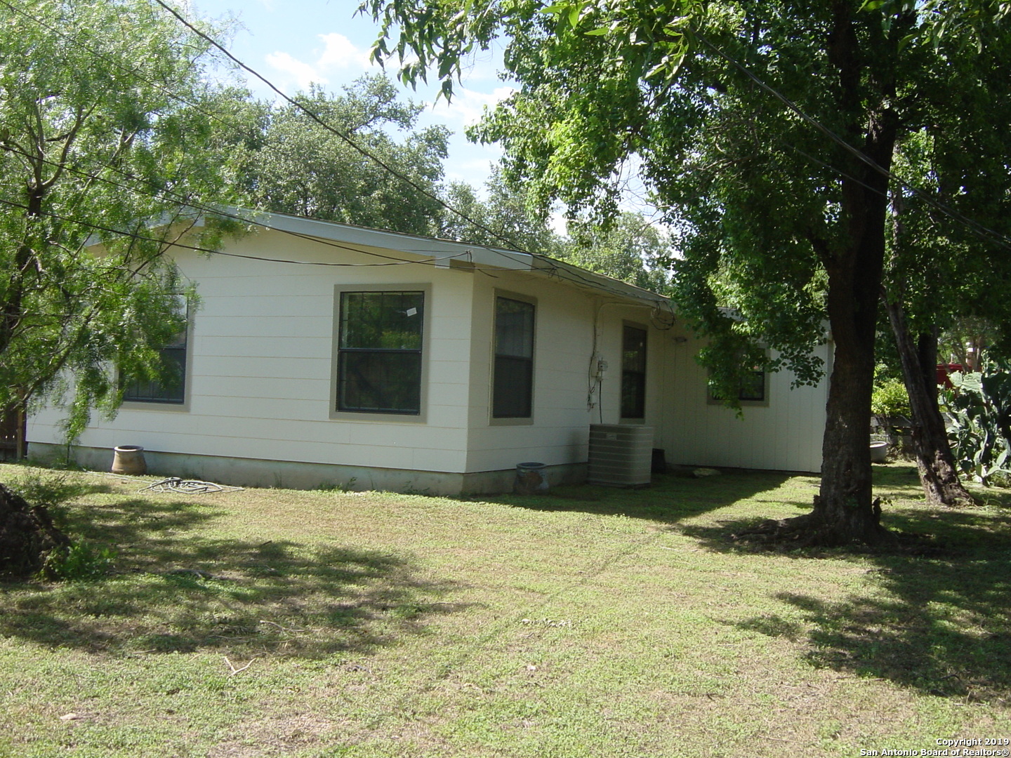 442 Sharon Drive San Antonio, TX 78216 - Photo 14 of 15 a view of a house with a backyard