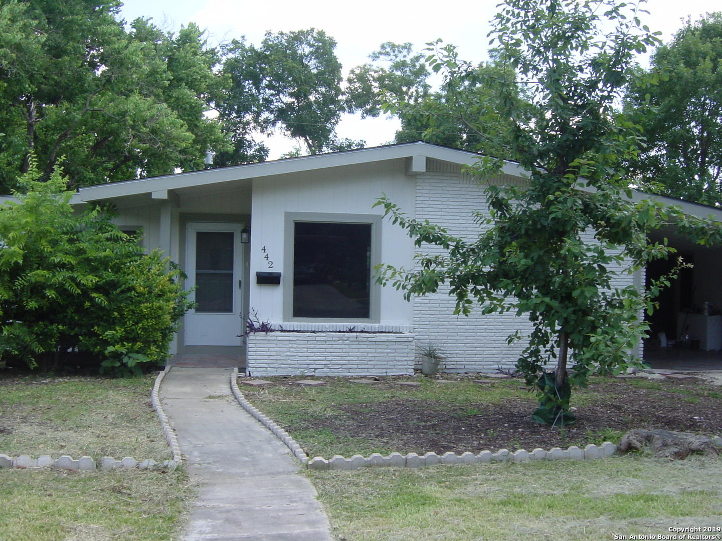 442 Sharon Drive San Antonio, TX 78216 - Photo 2 of 15 a front view of a house with garden