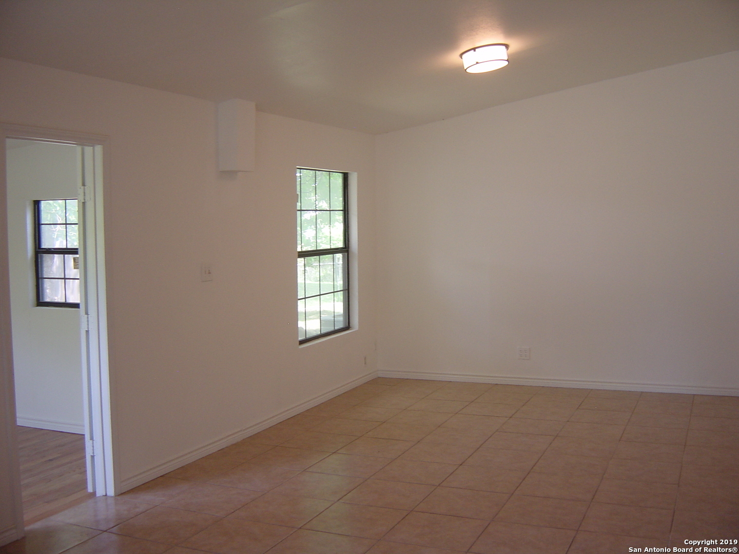 442 Sharon Drive San Antonio, TX 78216 - Photo 4 of 15 an empty room with windows