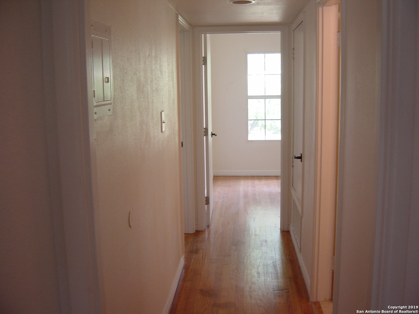 442 Sharon Drive San Antonio, TX 78216 - Photo 8 of 15 a view of a hallway with wooden floor