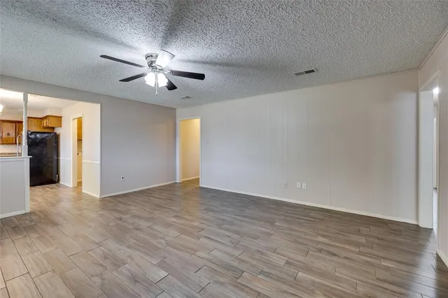 a view of an empty room with glass door
