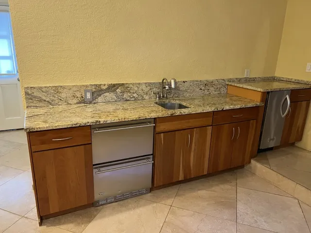 a view of a kitchen with a sink