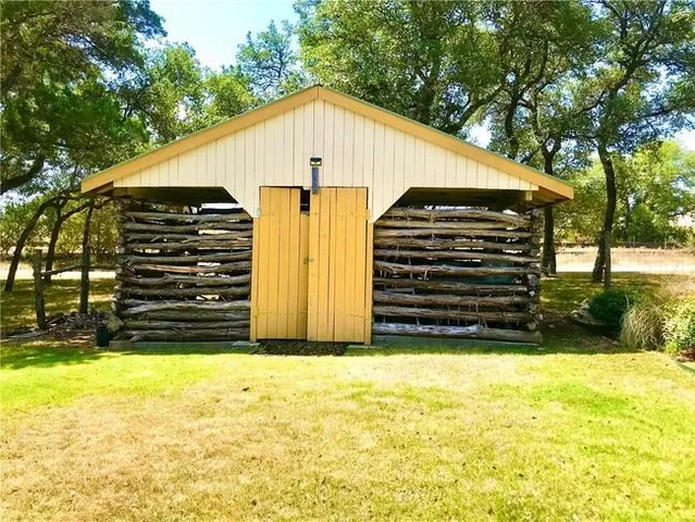 a view of a back yard of the house