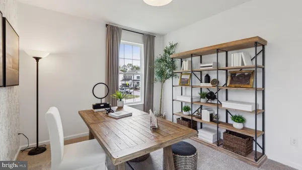 a workspace with furniture and a book shelf