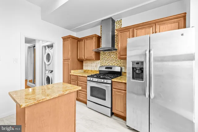 a kitchen that has a sink and a stove