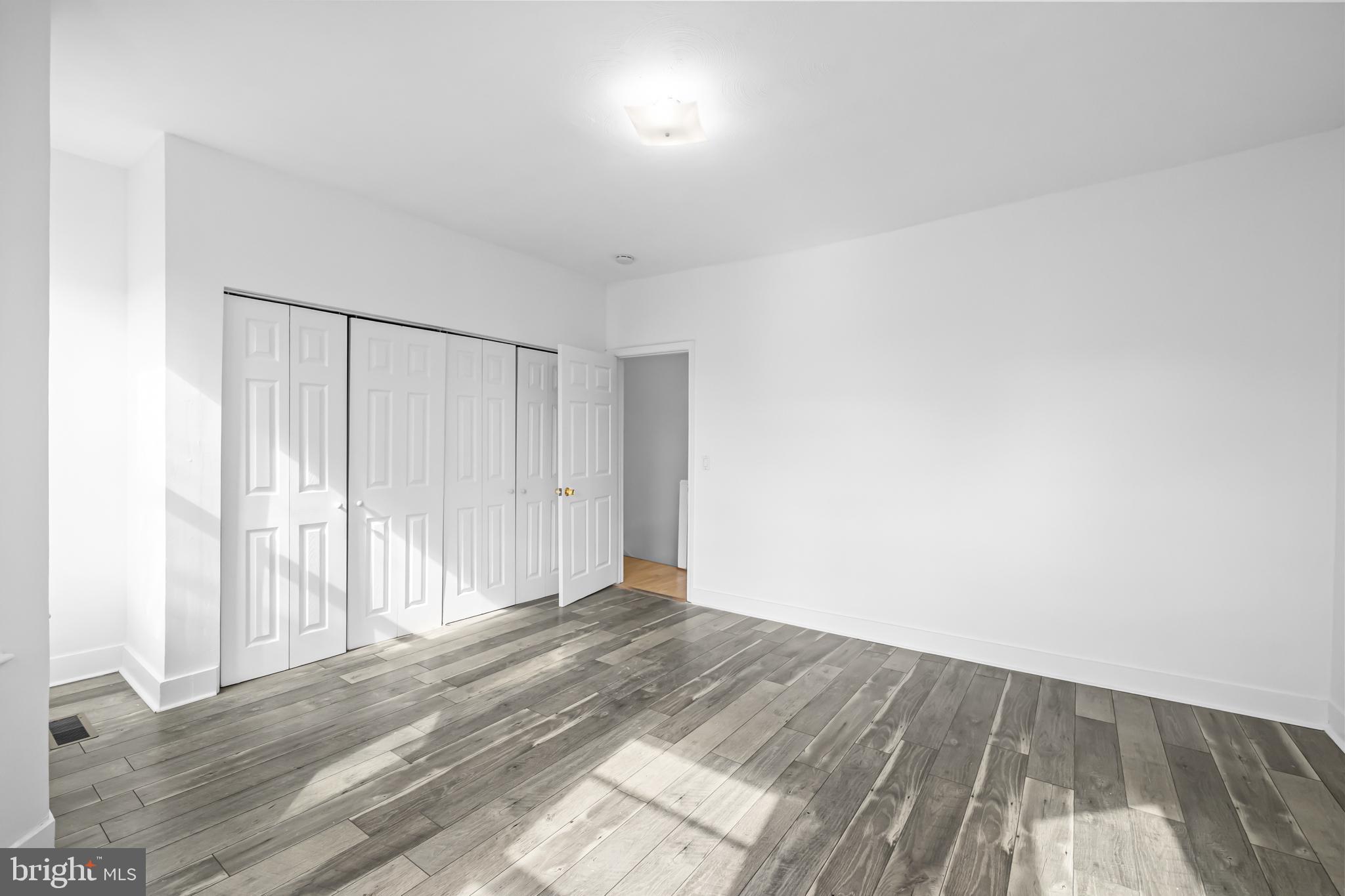 1021 Columbia Road Northwest Washington, DC 20001 - Photo 22 of 55 a view of room with wooden floor