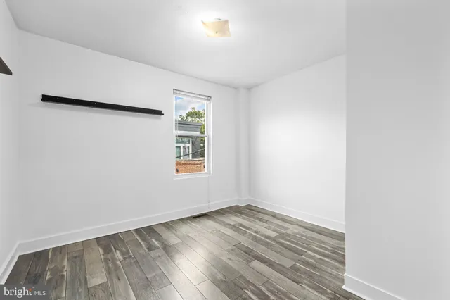 a view of a bedroom with washer and dryer
