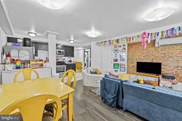 a kitchen with stainless steel appliances kitchen island granite countertop a stove and a refrigerator