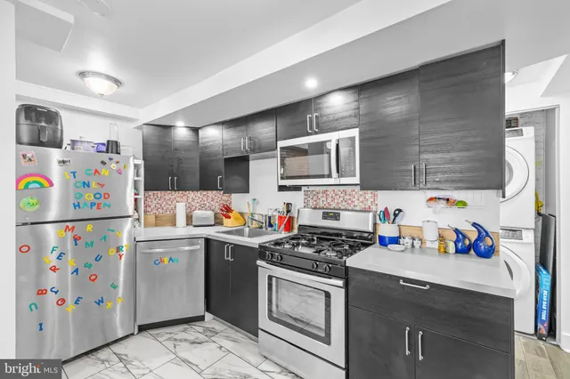 a dining room with furniture and a window