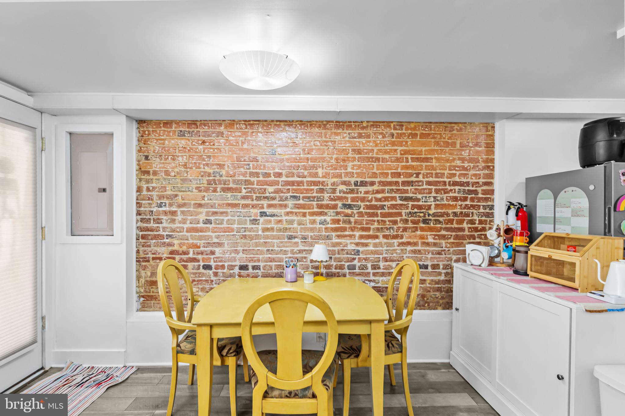 1021 Columbia Road Northwest Washington, DC 20001 - Photo 33 of 55 a dining room with furniture and a window