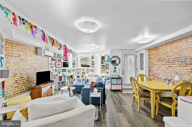 a bedroom with a bed and a book shelf