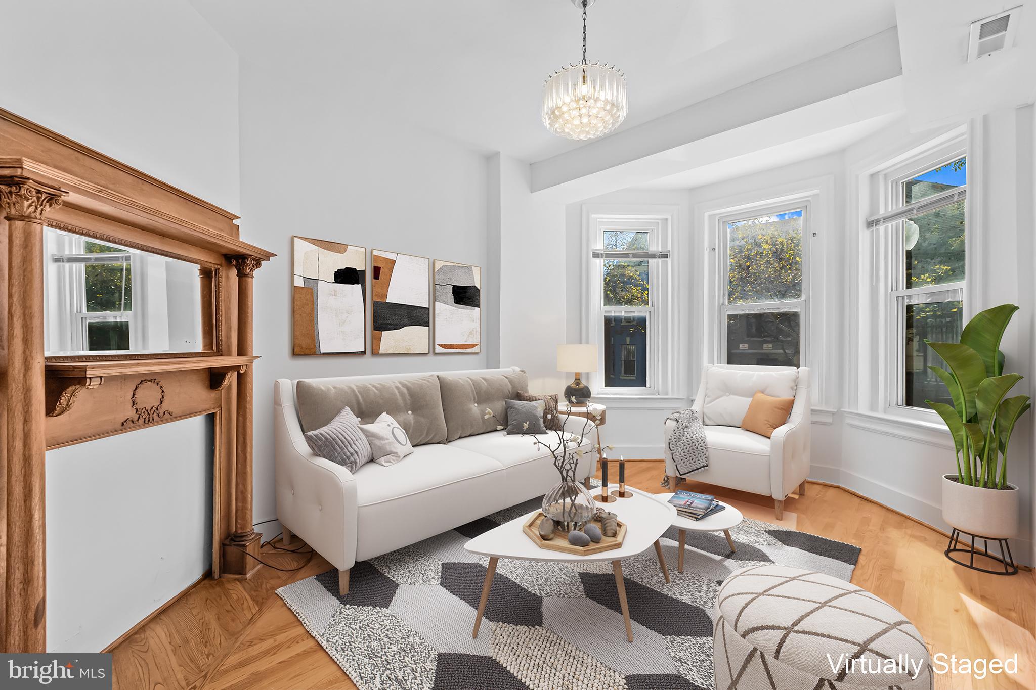 1021 Columbia Road Northwest Washington, DC 20001 - Photo 4 of 55 a living room with furniture potted plant and a large window