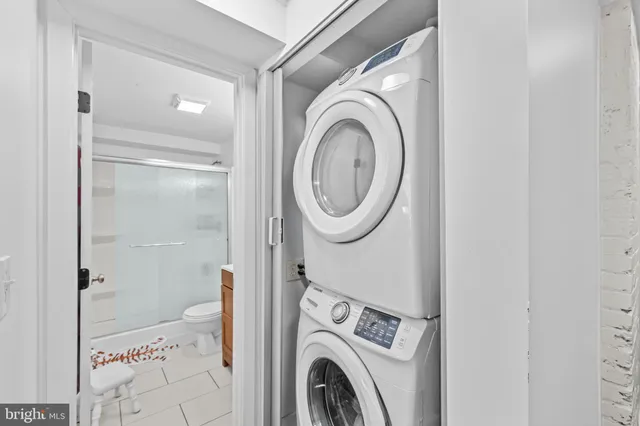 a bathroom with a sink mirror vanity and toilet