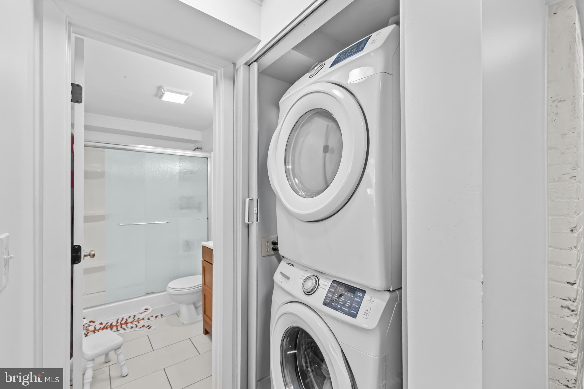 1021 Columbia Road Northwest Washington, DC 20001 - Photo 41 of 55 a view of a bathroom with a washer and dryer
