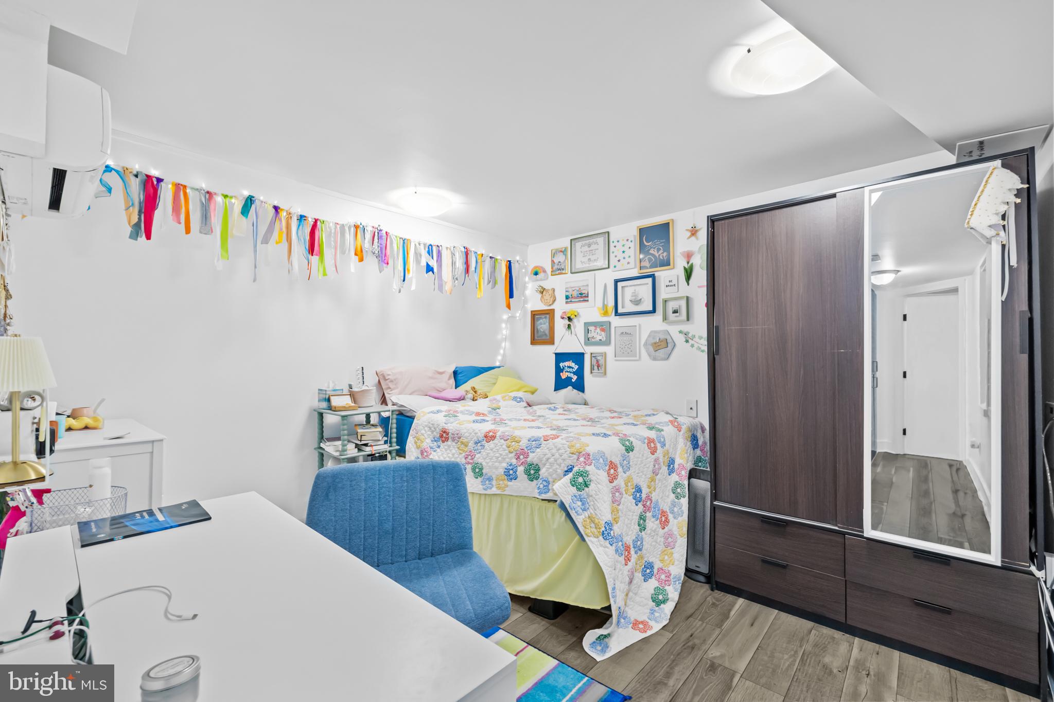 1021 Columbia Road Northwest Washington, DC 20001 - Photo 44 of 55 a bedroom with a bed and a dresser