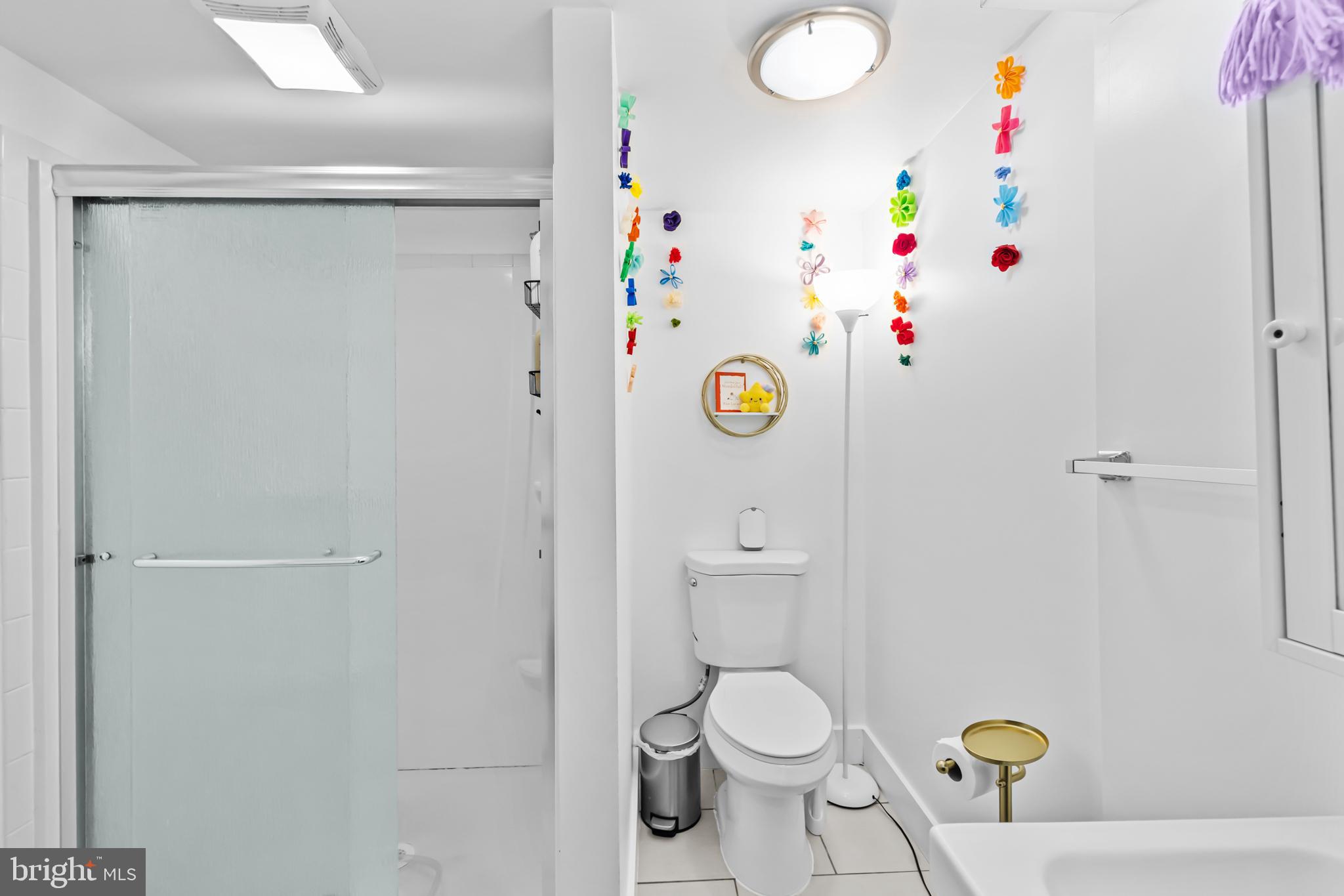 1021 Columbia Road Northwest Washington, DC 20001 - Photo 46 of 55 a bathroom with a sink mirror vanity and toilet