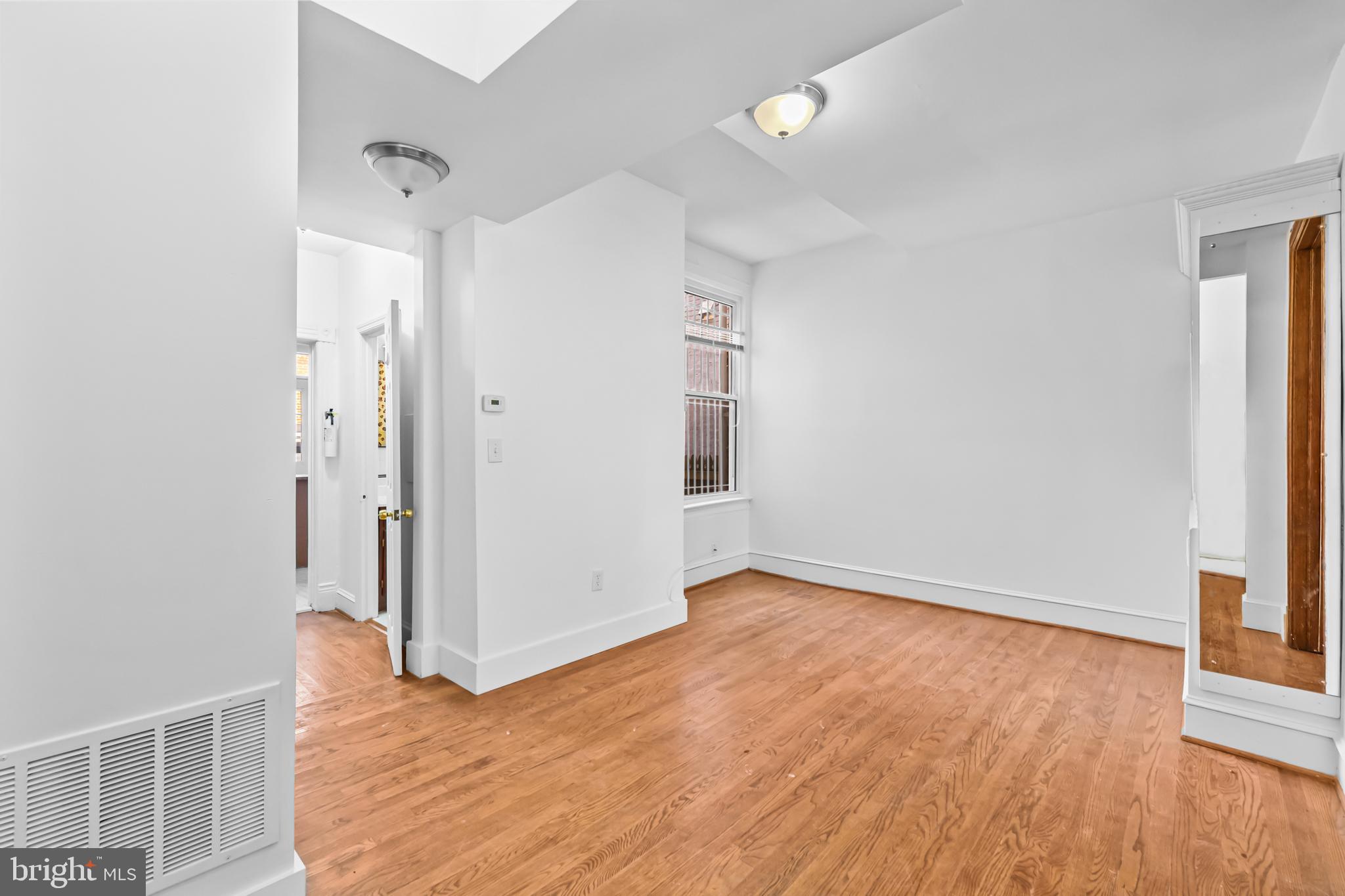 1021 Columbia Road Northwest Washington, DC 20001 - Photo 10 of 55 wooden floor in an empty room