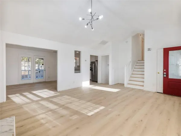 a view of an empty room with a window