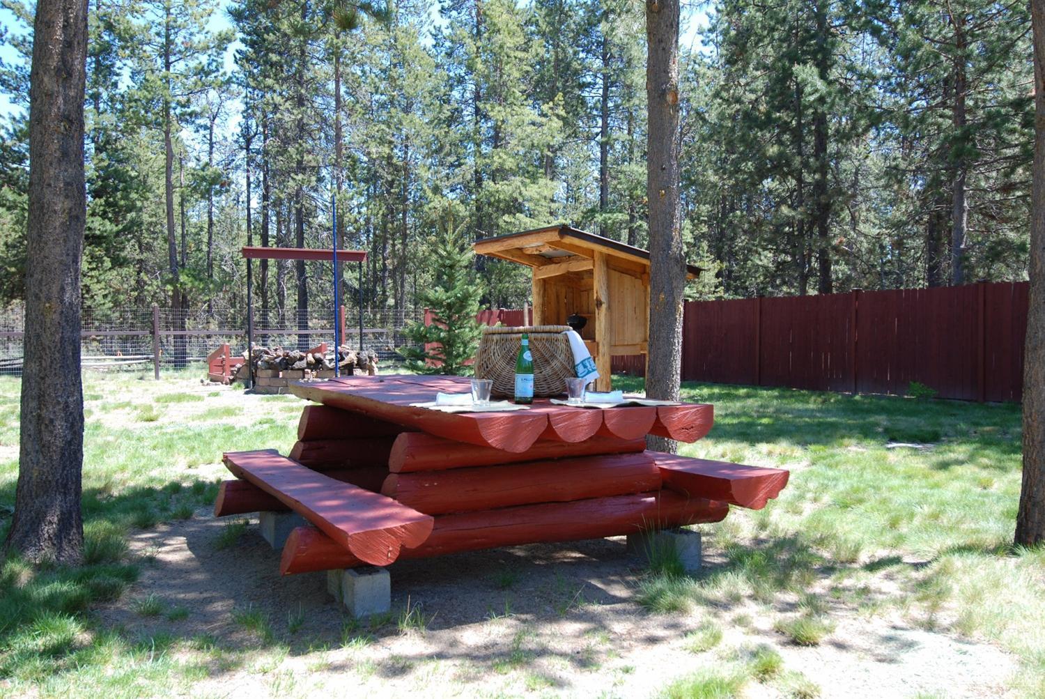 55726 Snow Goose Road Bend, OR 97707 - Photo 18 of 25 a view of a yard with a sitting area