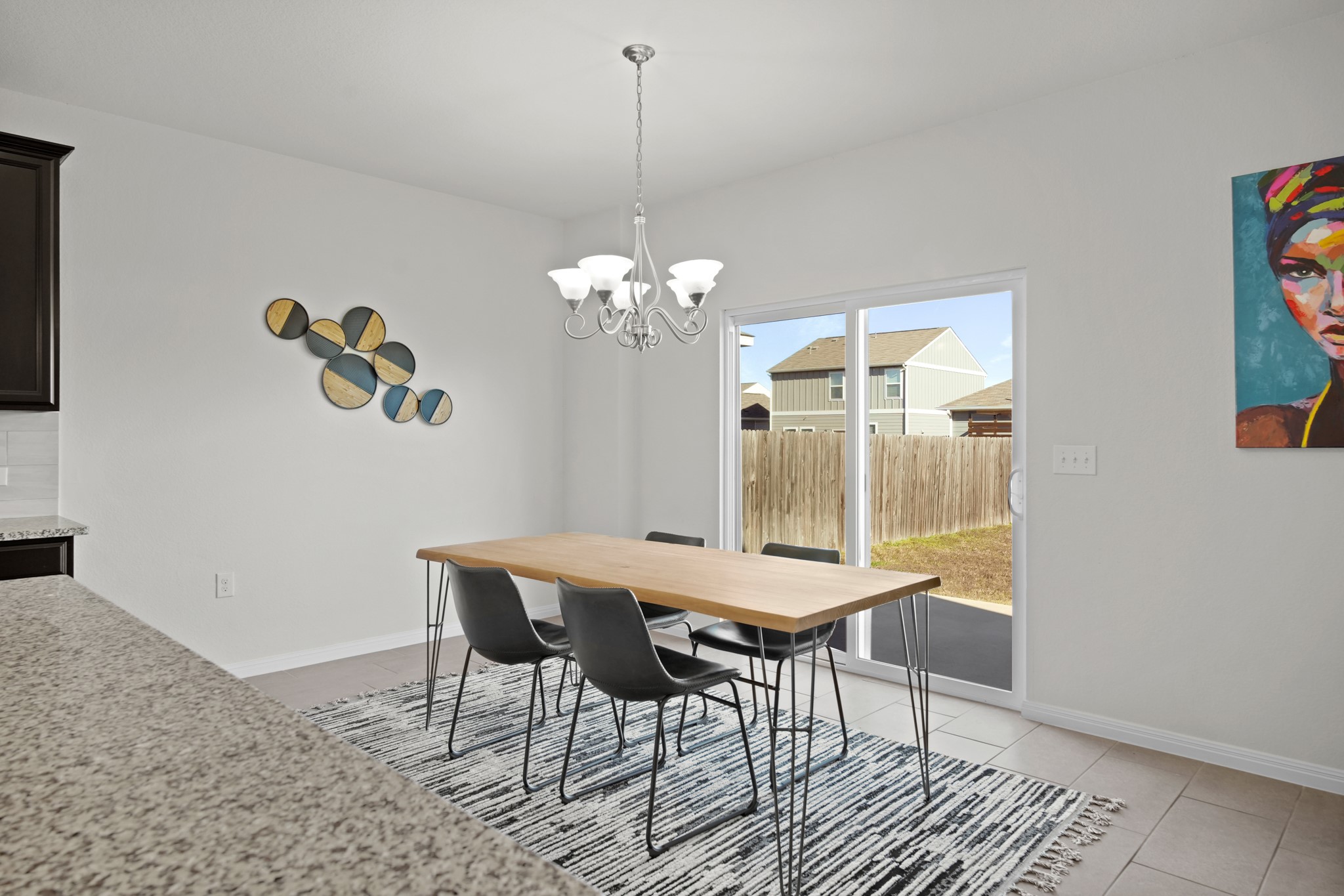 13005 Foreston Drive Austin, TX 78754 - Photo 8 of 36 a dining room with furniture a rug and wooden floor