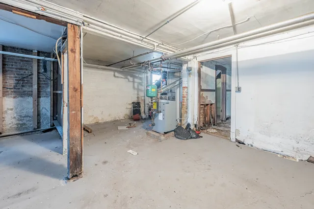 a view of a big room with wooden walls