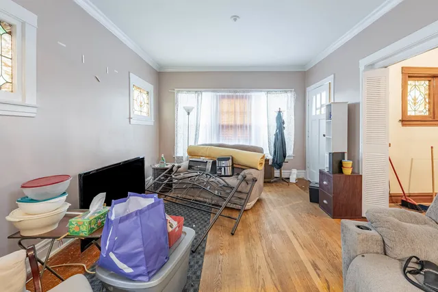 a bed room with a bed and a chair