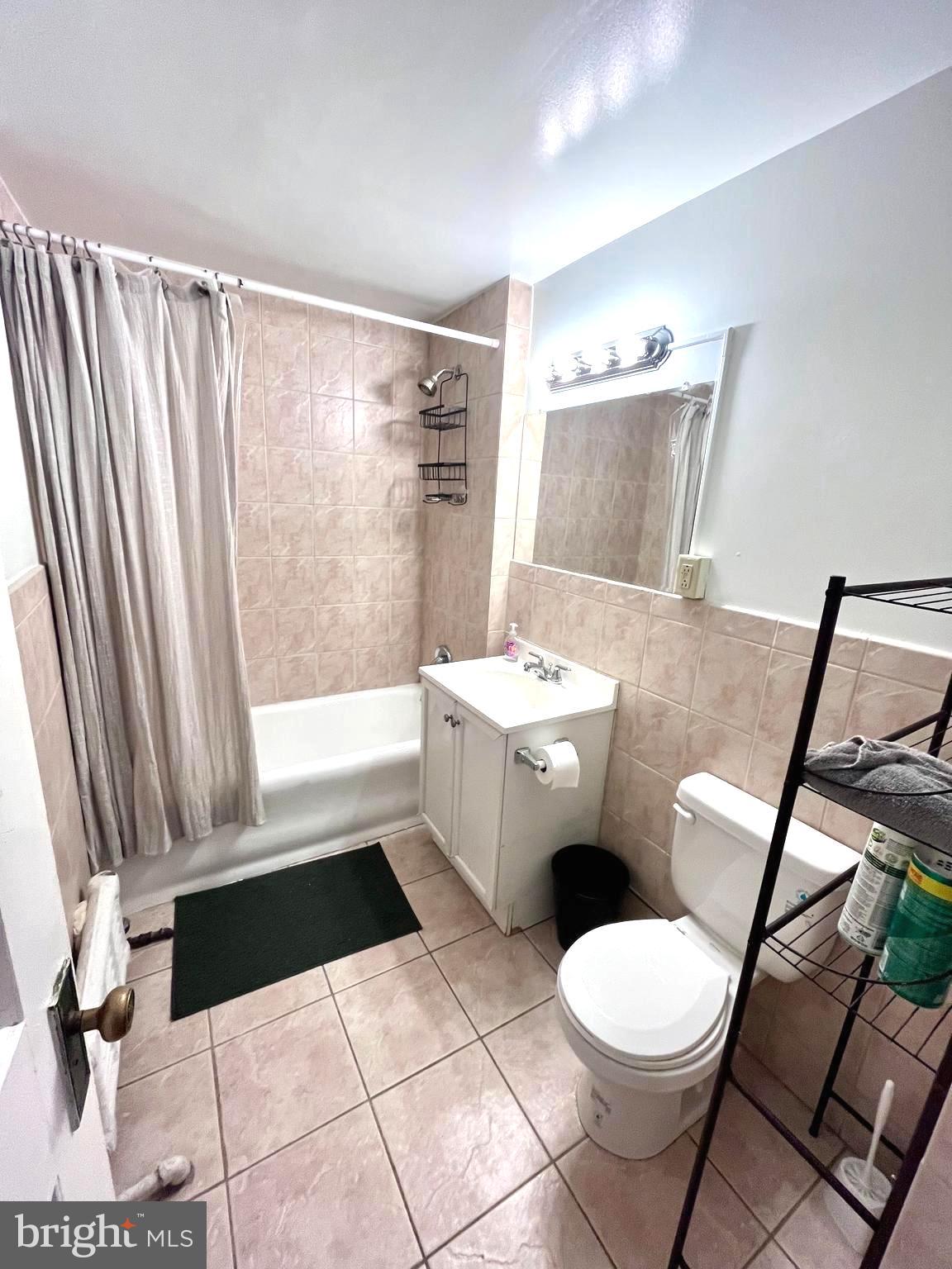 1324 Locust Street, Unit 314 Philadelphia, PA 19107 - Photo 4 of 7 a bathroom with a sink toilet and shower