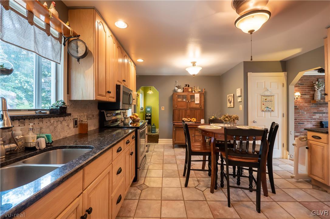 130 County Line Road Riegelsville, PA 18077 - Photo 17 of 40 a large kitchen with a table and chairs